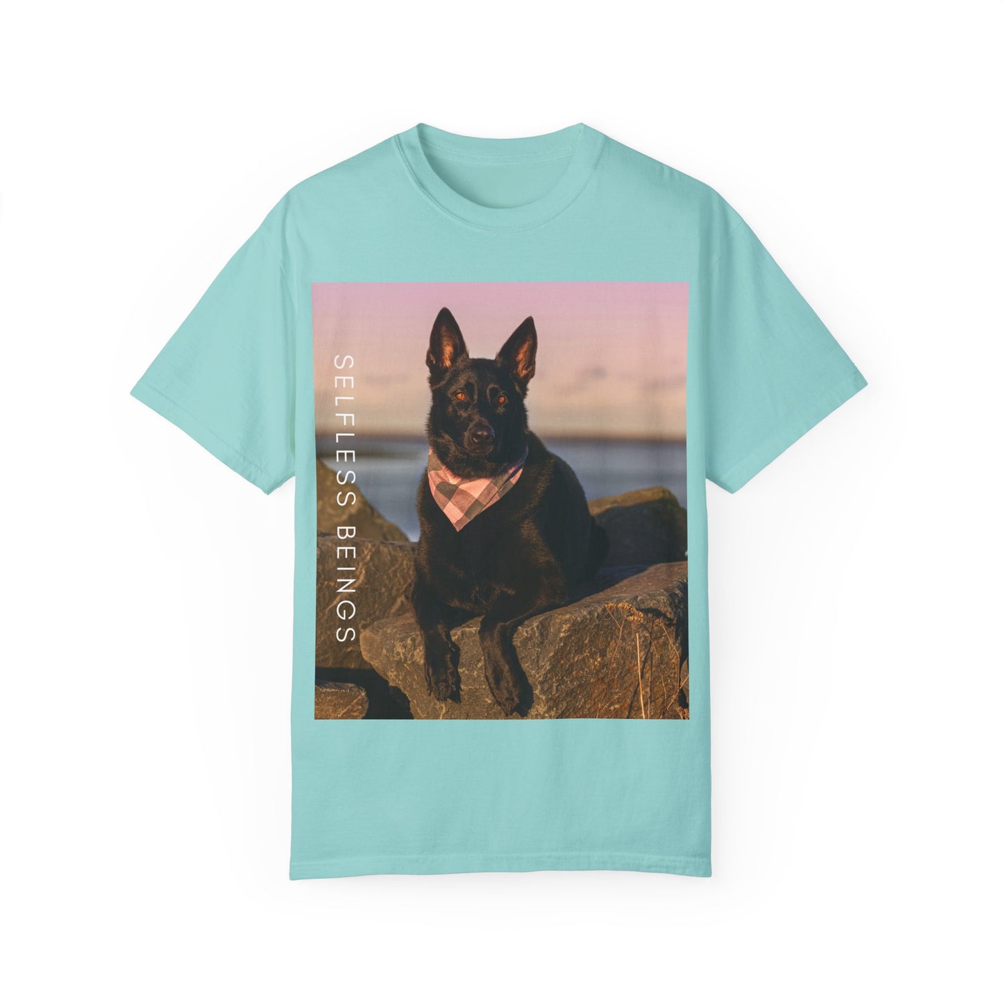 Unisex Dog Lover T-shirt With Solid Black German Shepherd Wearing a Romal Sitting on the Seaside Rocks and Caption Selfless Beings