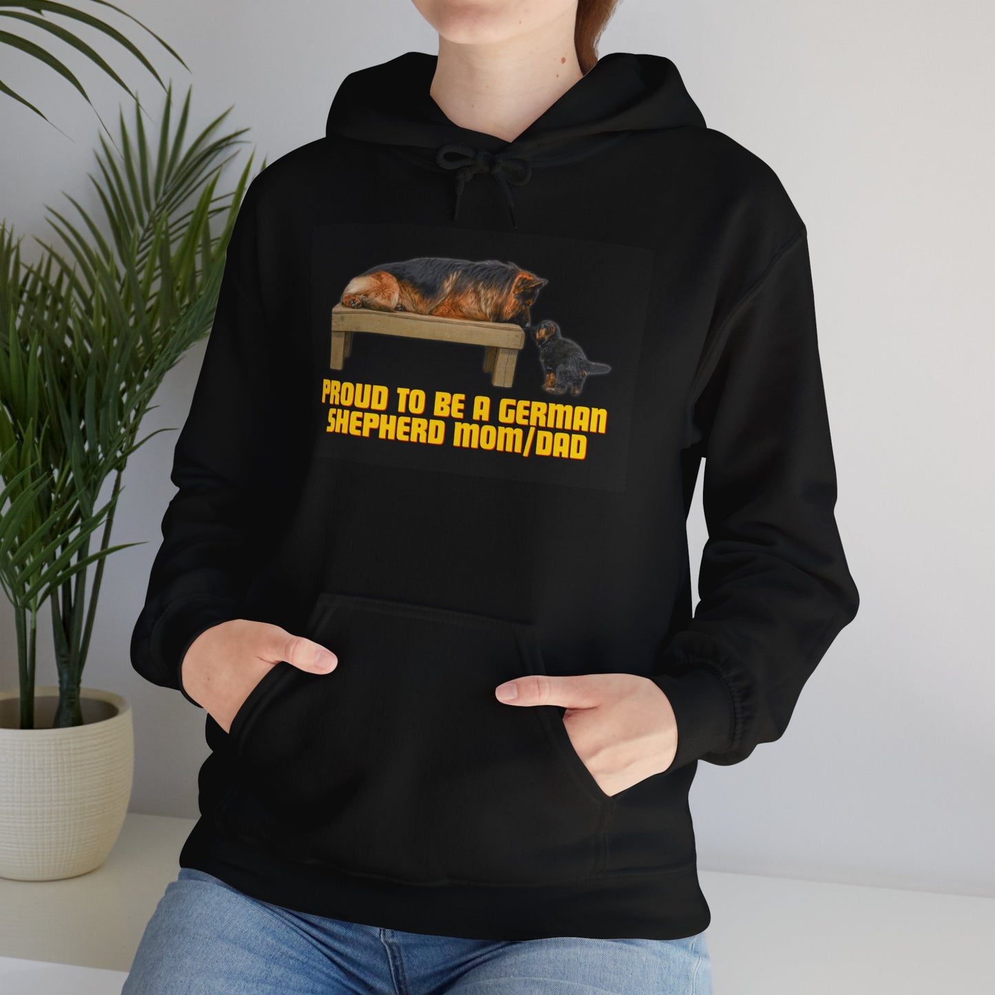 Unisex Dog Lover Hoodie With German Shepherd Lying On The Wooden Bed Looking at Puppy and Caption Proud Mom/Dad