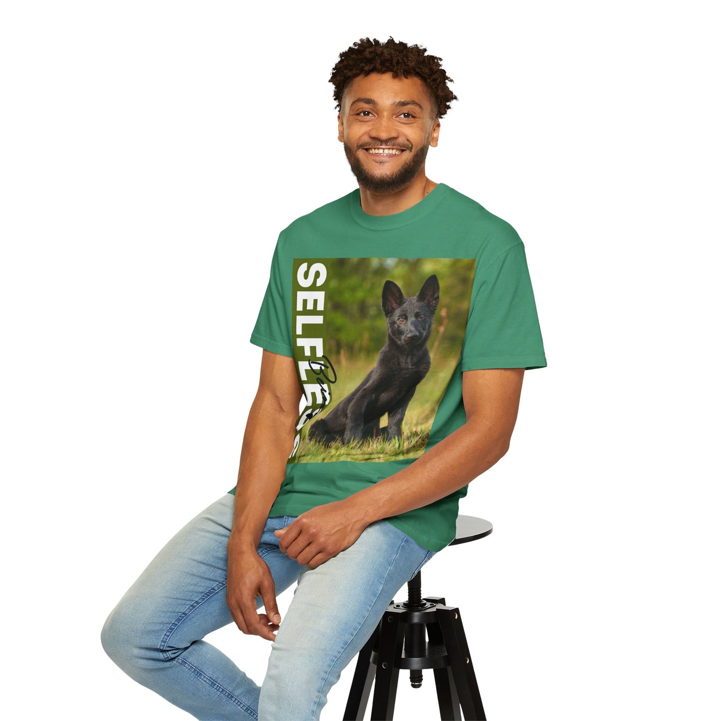 Unisex Dog Lover T-Shirt With Solid Black German Shepherd Puppy Sloppily Sitting on the Green Pasture and Caption Selfless Beings