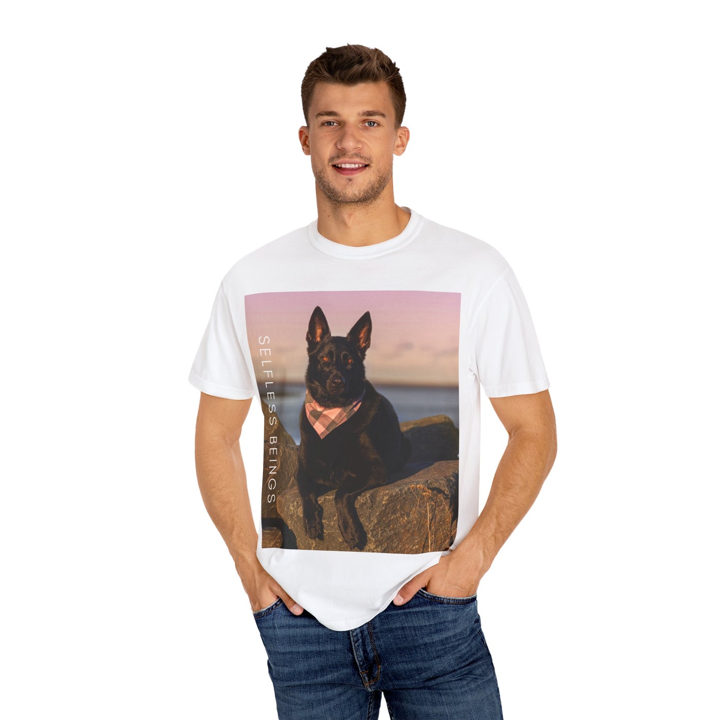 Unisex Dog Lover T-shirt With Solid Black German Shepherd Wearing a Romal Sitting on the Seaside Rocks and Caption Selfless Beings