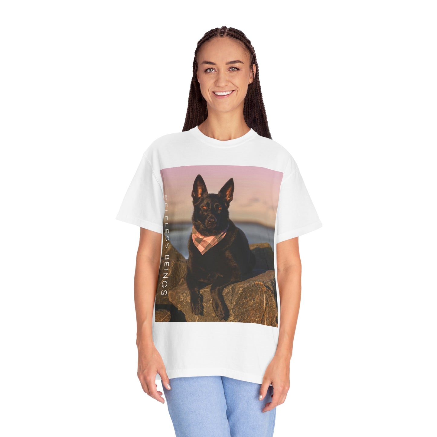 Unisex Dog Lover T-shirt With Solid Black German Shepherd Wearing a Romal Sitting on the Seaside Rocks and Caption Selfless Beings