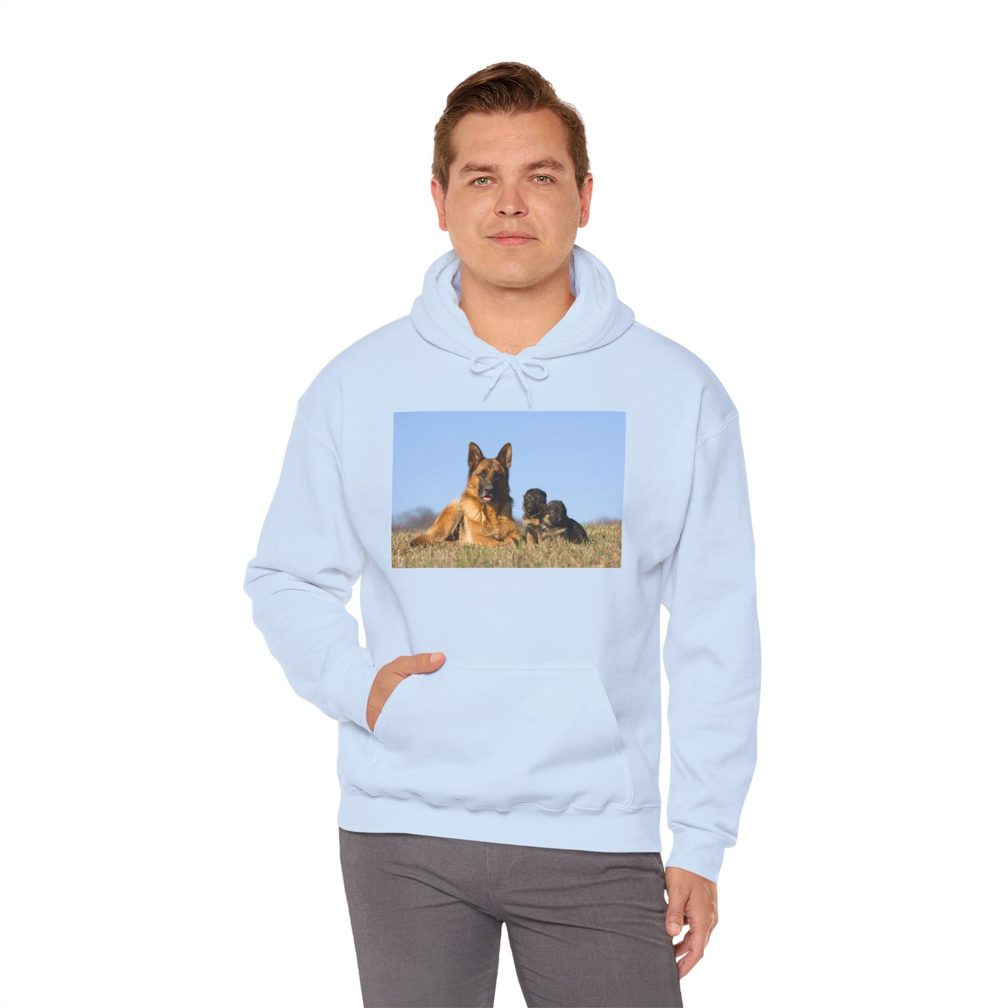 A Unisex Dog Lover Hoodie With a German Shepherd Lying on the Grass With Two Puppies