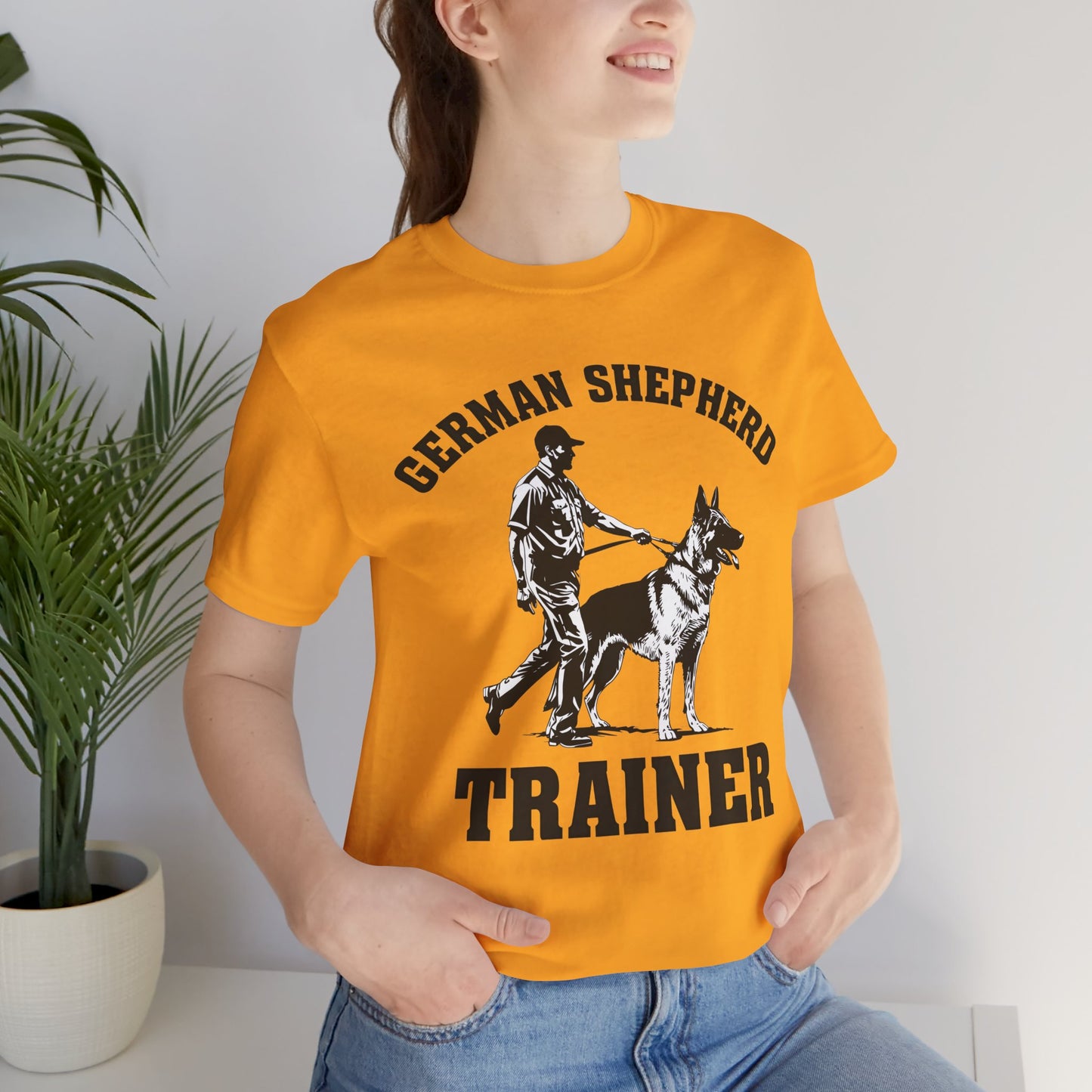 German Shepherd Trainer Tee - Black and White Design of Man Holding a German Shepherd