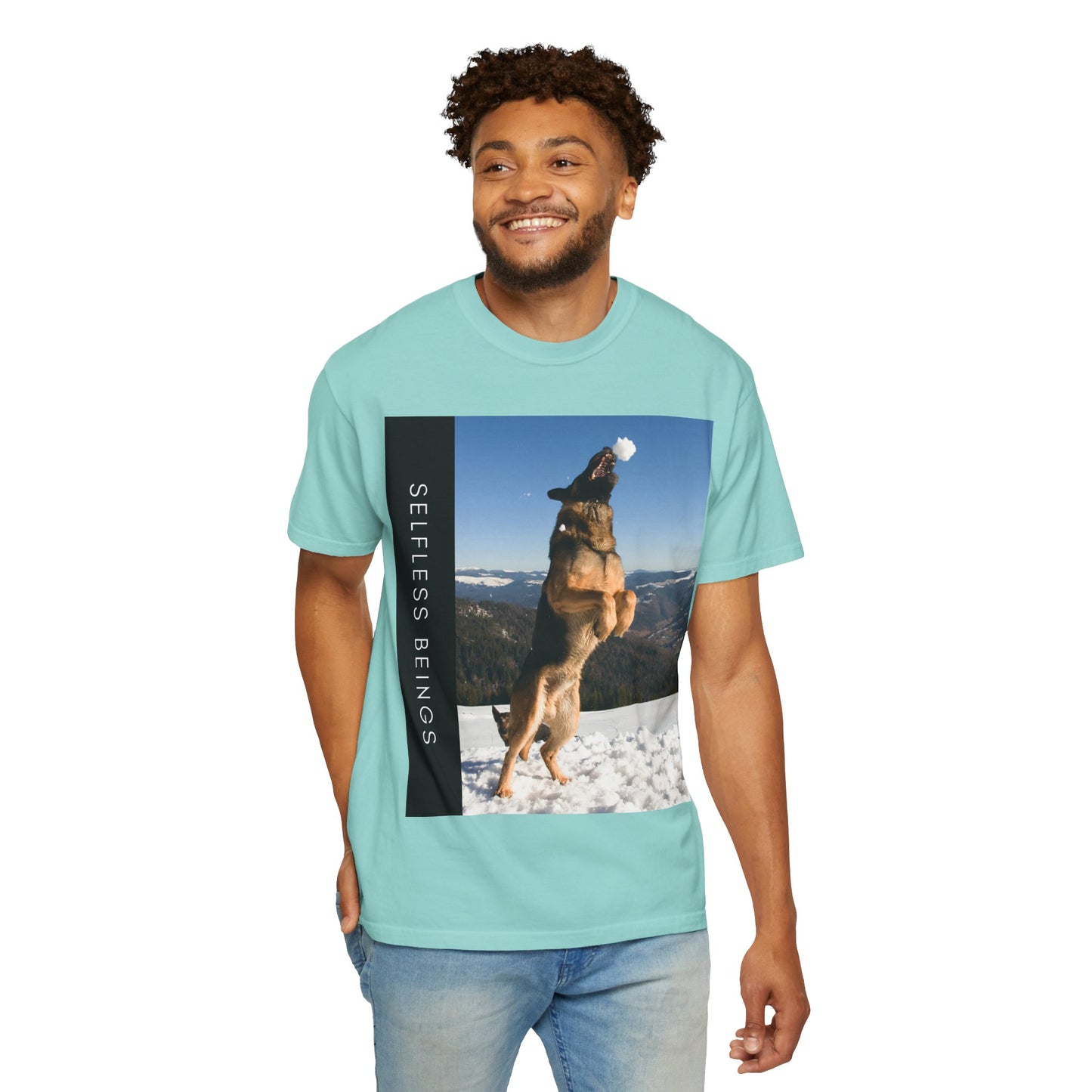 Unisex Dog Lover T-Shirt With a German Shepherd Jumps Upward to Catch a Small Snowball With Mouth and Caption Selfless Beings