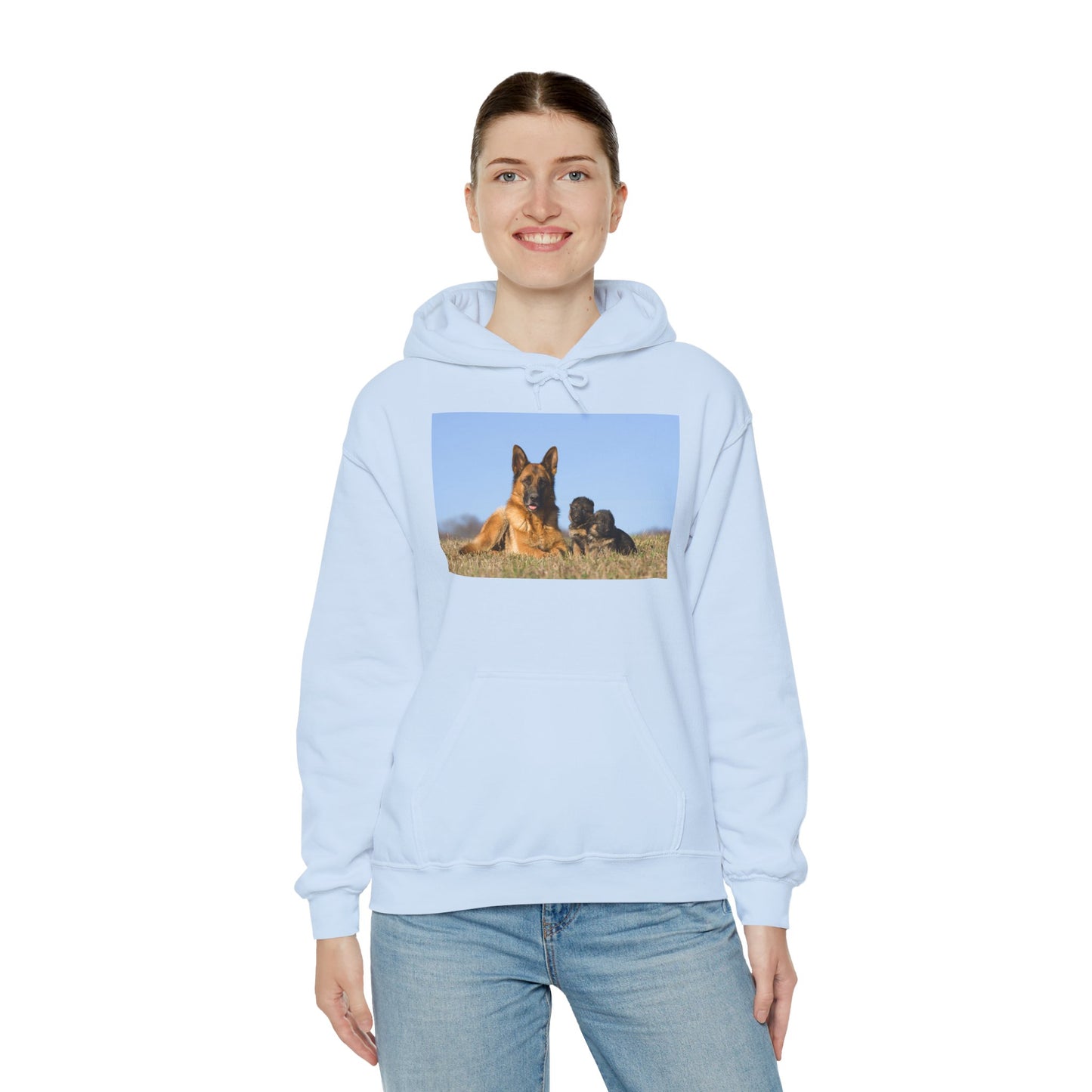 A Unisex Dog Lover Hoodie With a German Shepherd Lying on the Grass With Two Puppies