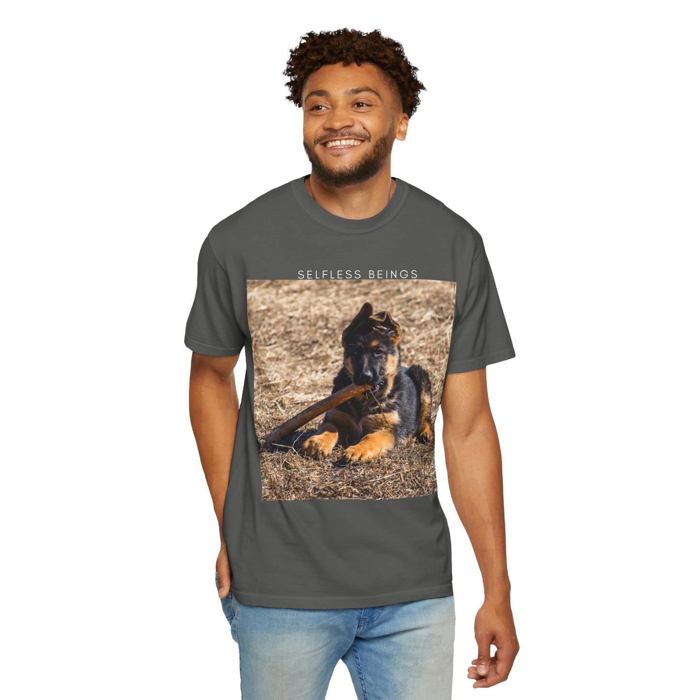 Unisex Dog Lover T-Shirt With a German Shepherd Puppy Playing With Wooden Stick on Dry Grass and Caption Selfless Beings