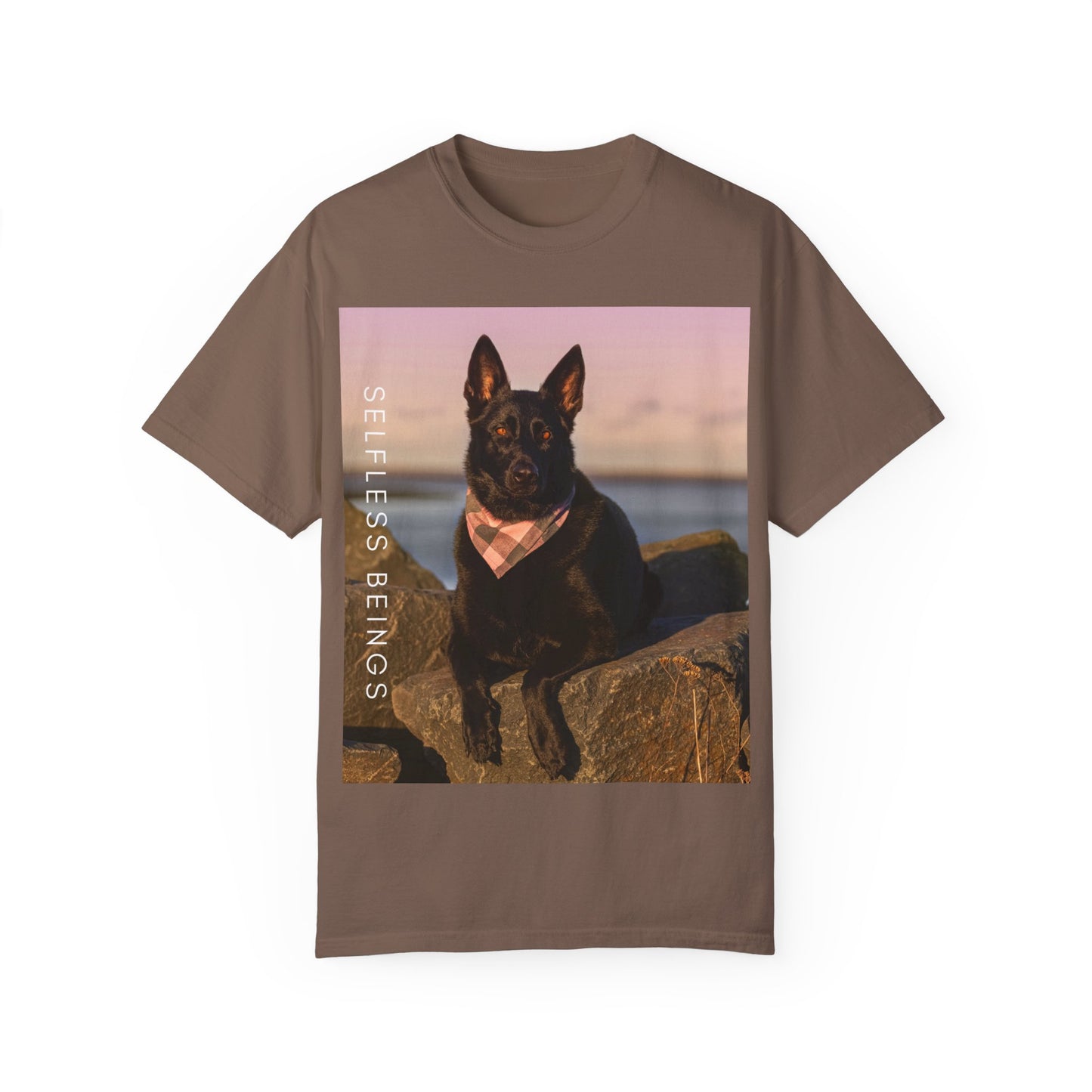 Unisex Dog Lover T-shirt With Solid Black German Shepherd Wearing a Romal Sitting on the Seaside Rocks and Caption Selfless Beings