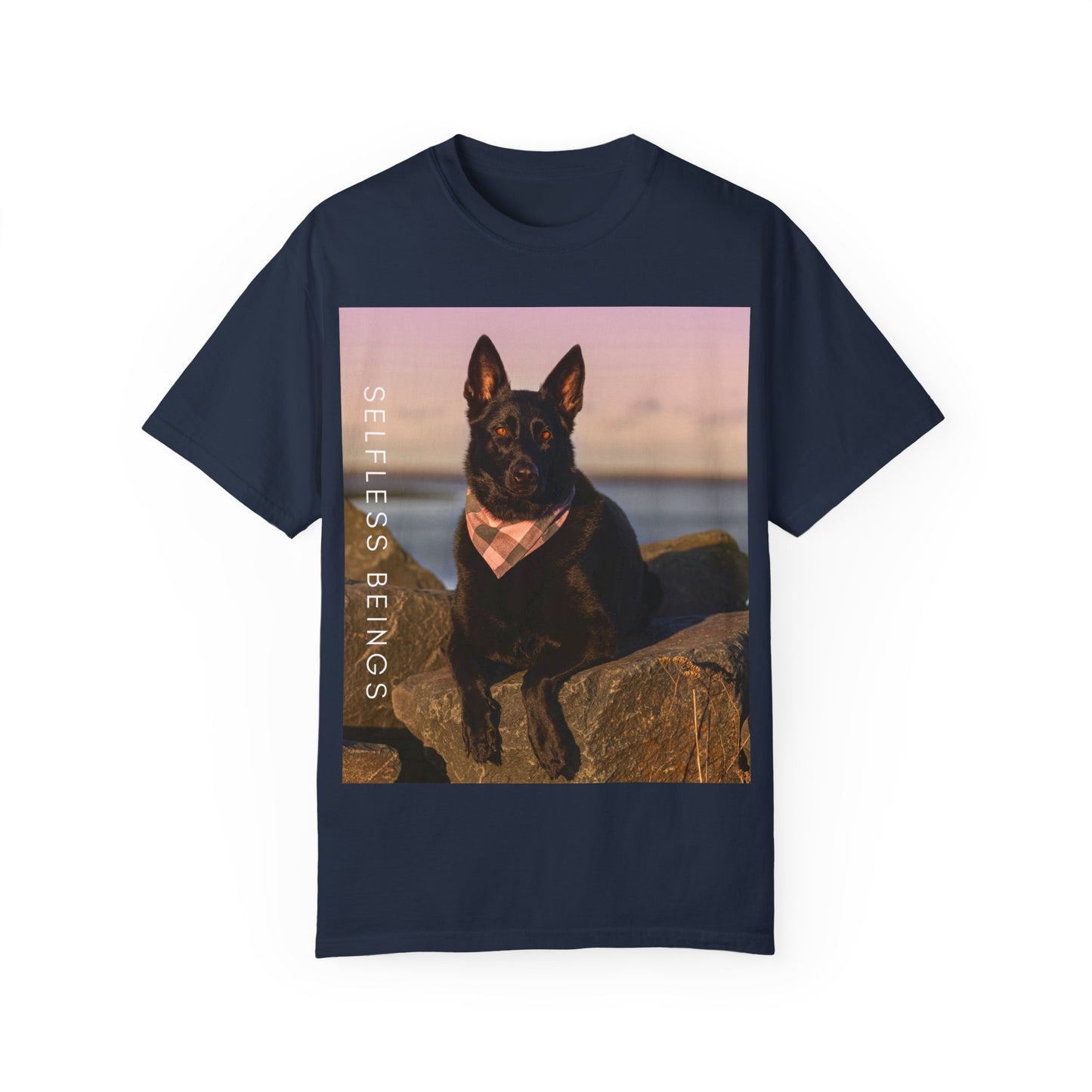Unisex Dog Lover T-shirt With Solid Black German Shepherd Wearing a Romal Sitting on the Seaside Rocks and Caption Selfless Beings