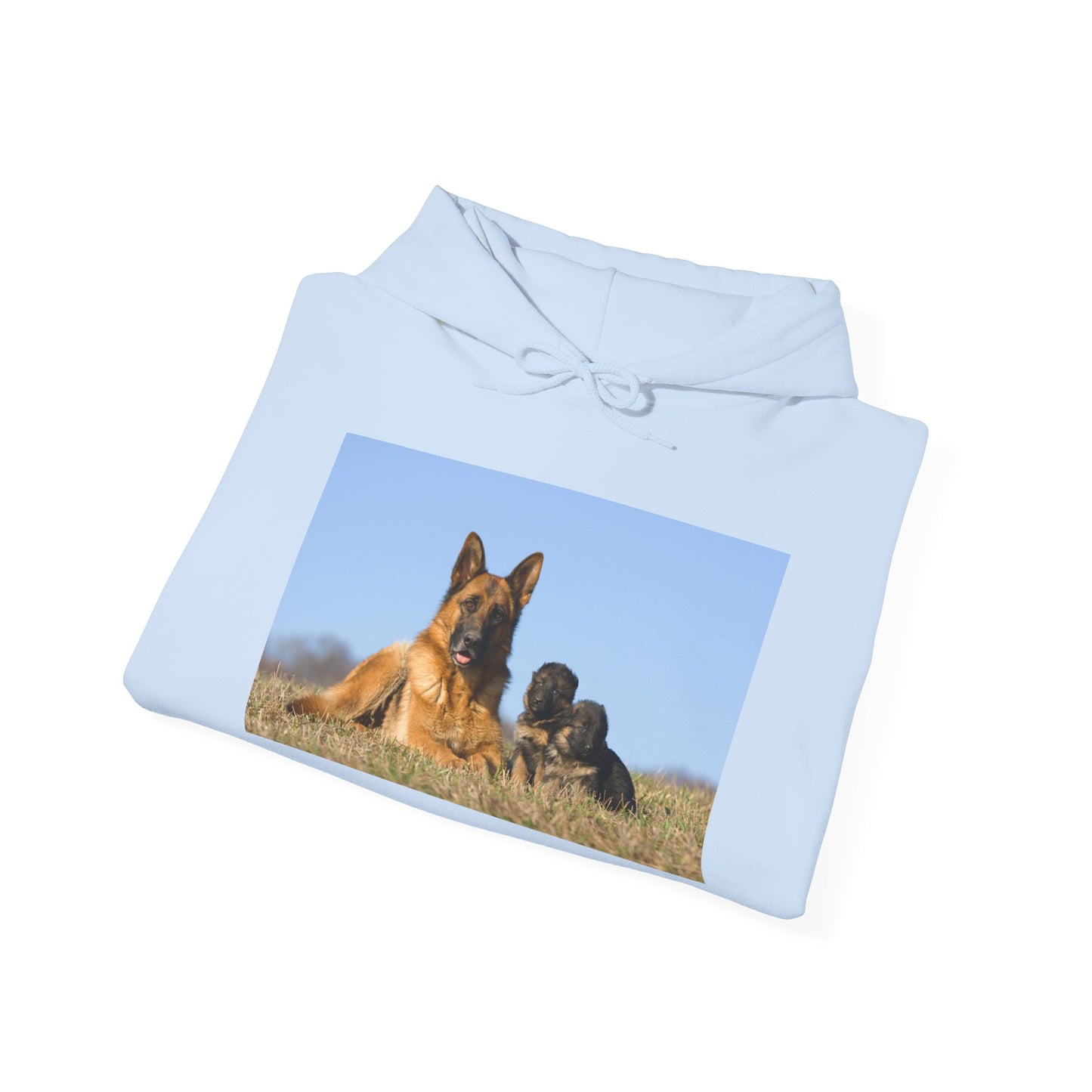A Unisex Dog Lover Hoodie With a German Shepherd Lying on the Grass With Two Puppies