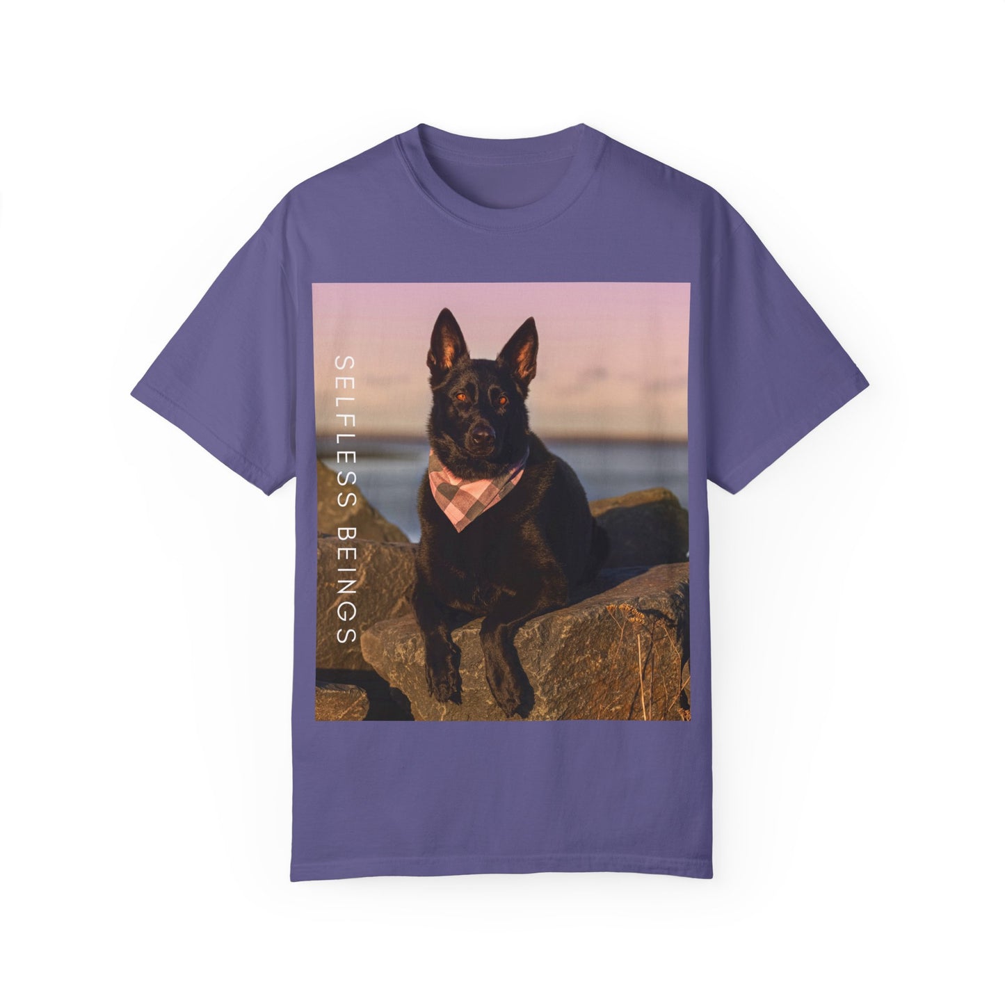 Unisex Dog Lover T-shirt With Solid Black German Shepherd Wearing a Romal Sitting on the Seaside Rocks and Caption Selfless Beings