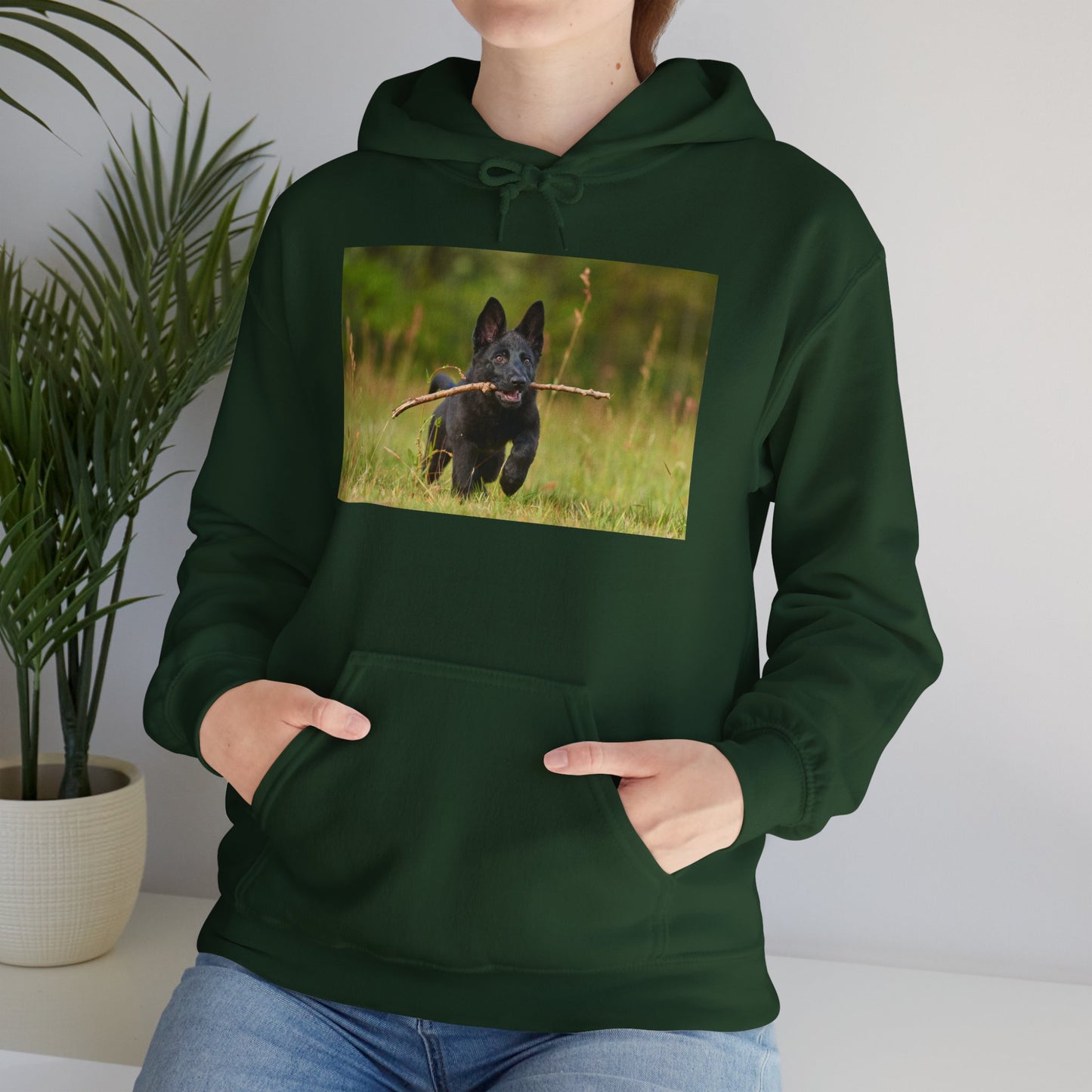 Unisex Dog Lover Hoodie With Black German Shepherd Puppy Running on the Grass Holding a Stick in the Mouth