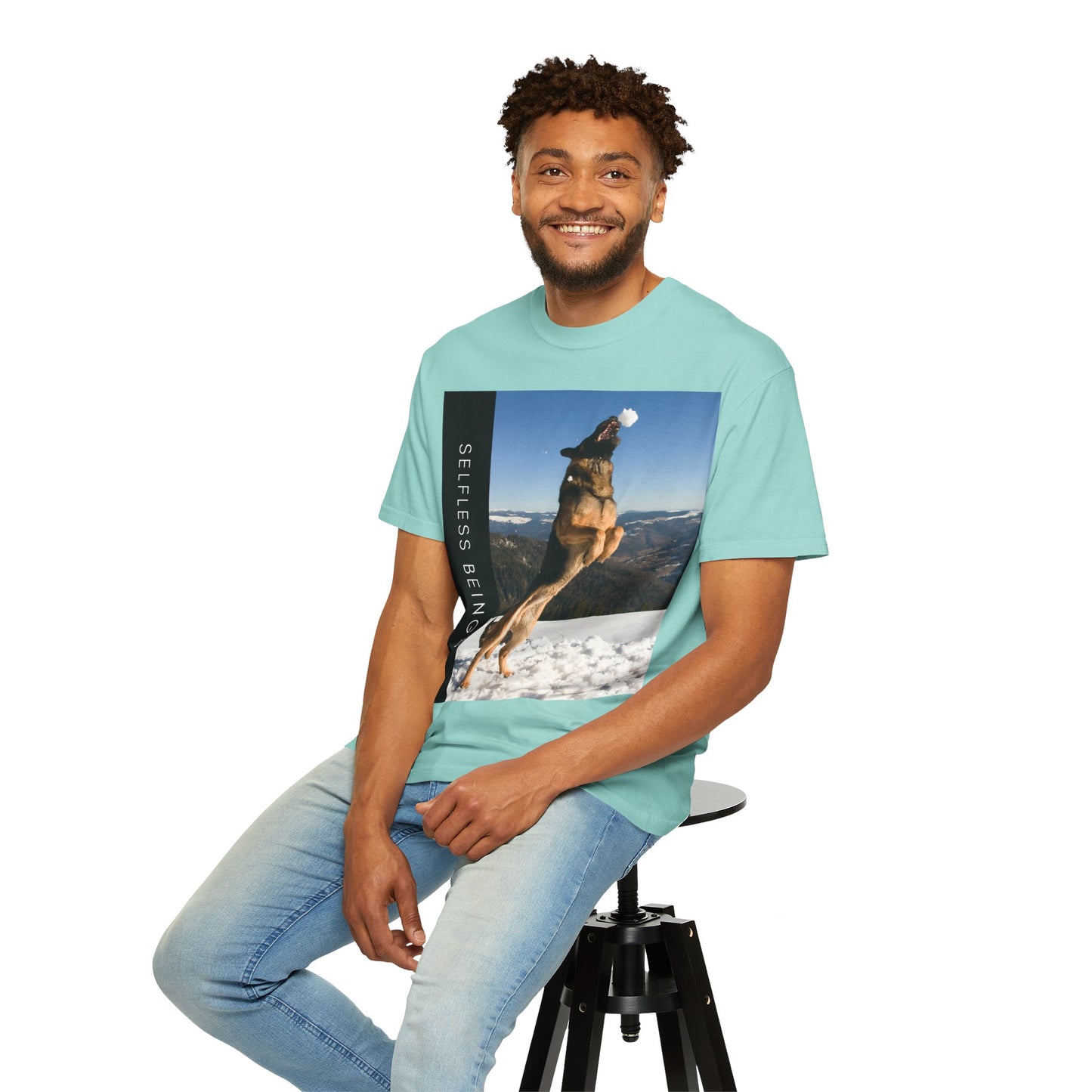 Unisex Dog Lover T-Shirt With a German Shepherd Jumps Upward to Catch a Small Snowball With Mouth and Caption Selfless Beings