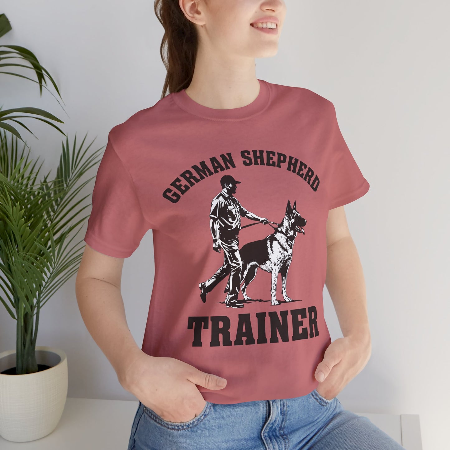 German Shepherd Trainer Tee - Black and White Design of Man Holding a German Shepherd