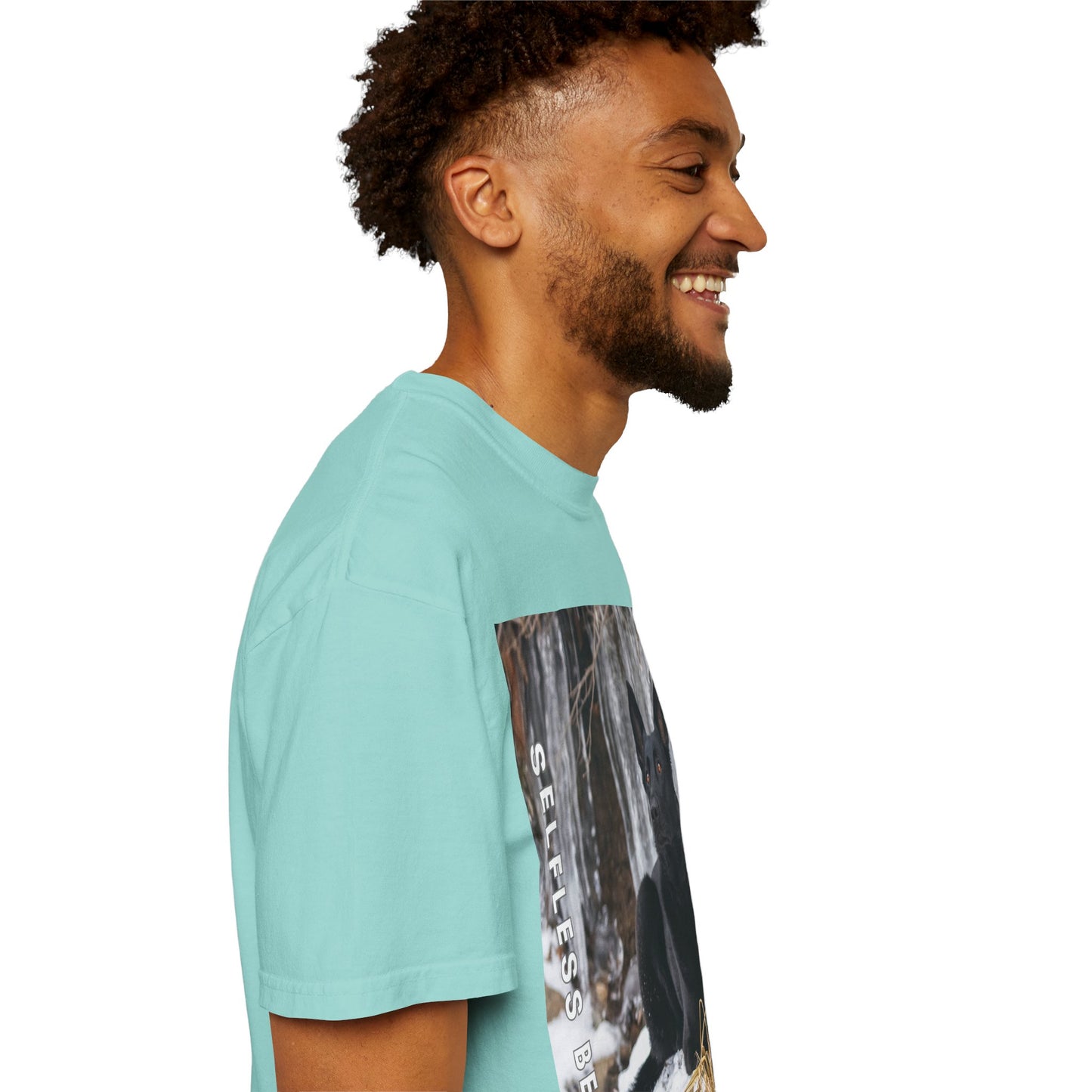 Unisex Dog Lover T-Shirt With Solid Black German Shepherd Sitting on the Snow, Ice Spikes in the Background and Caption Selfless Beings