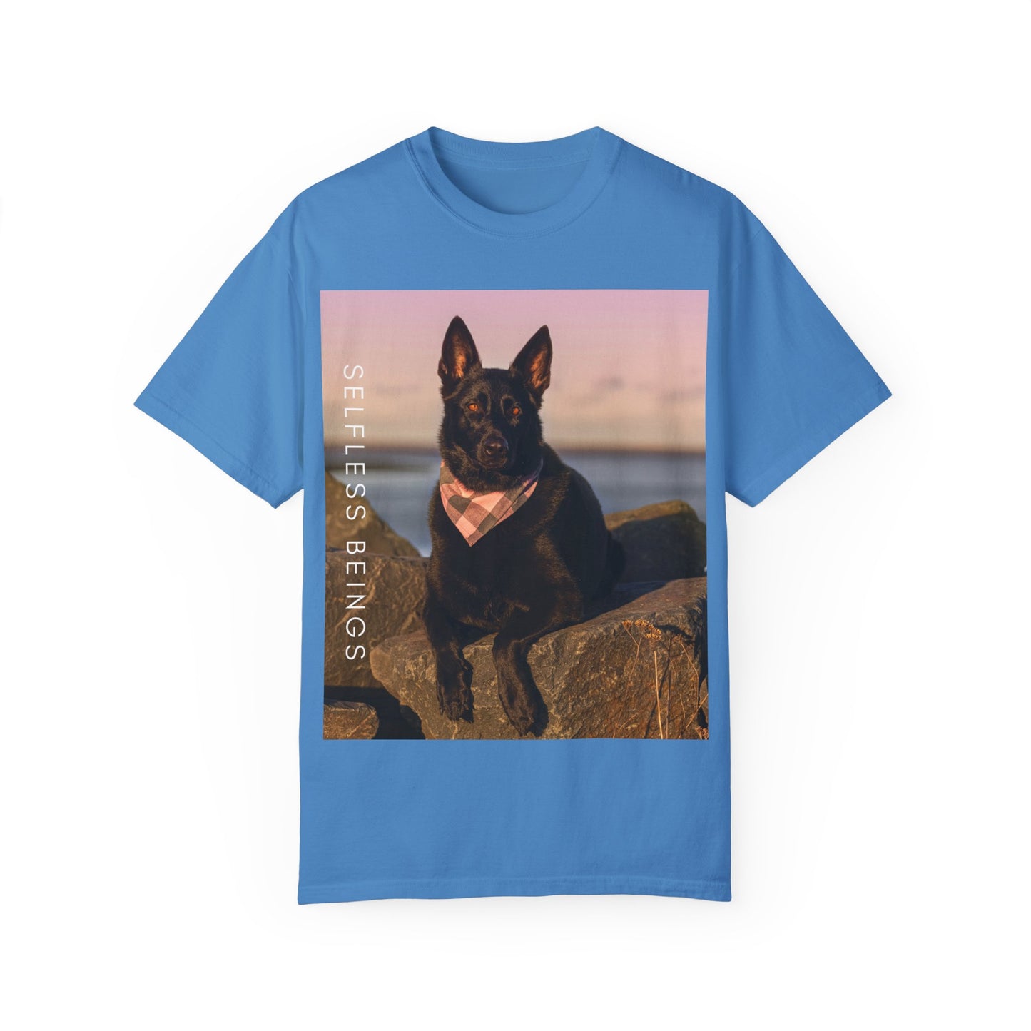 Unisex Dog Lover T-shirt With Solid Black German Shepherd Wearing a Romal Sitting on the Seaside Rocks and Caption Selfless Beings