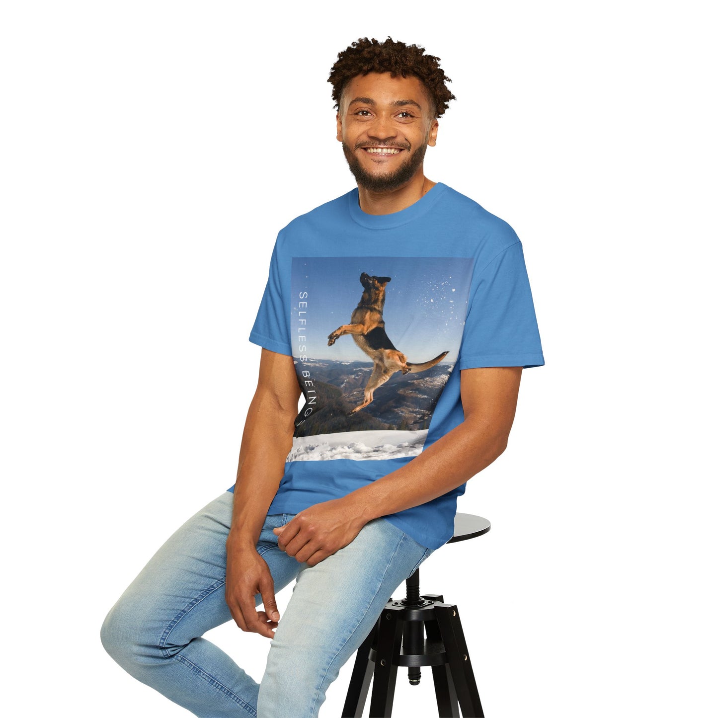 Unisex Dog Lover T-Shirt With a German Shepherd in the Air on Top of Snow Mountain and Caption Selfless Beings