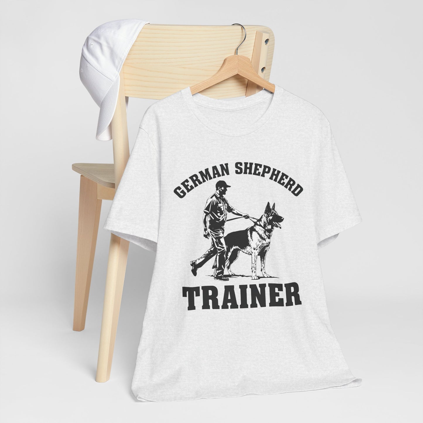 German Shepherd Trainer Tee - Black and White Design of Man Holding a German Shepherd