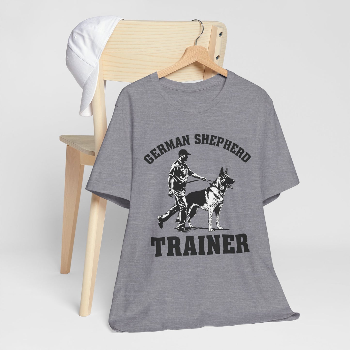 German Shepherd Trainer Tee - Black and White Design of Man Holding a German Shepherd