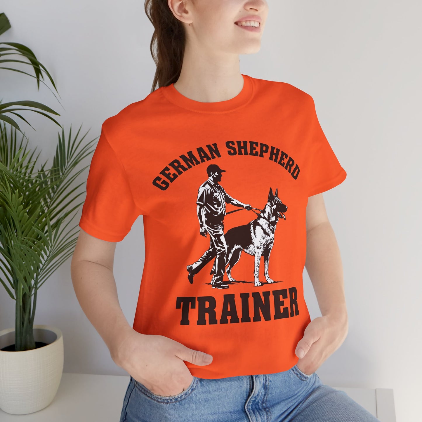 German Shepherd Trainer Tee - Black and White Design of Man Holding a German Shepherd
