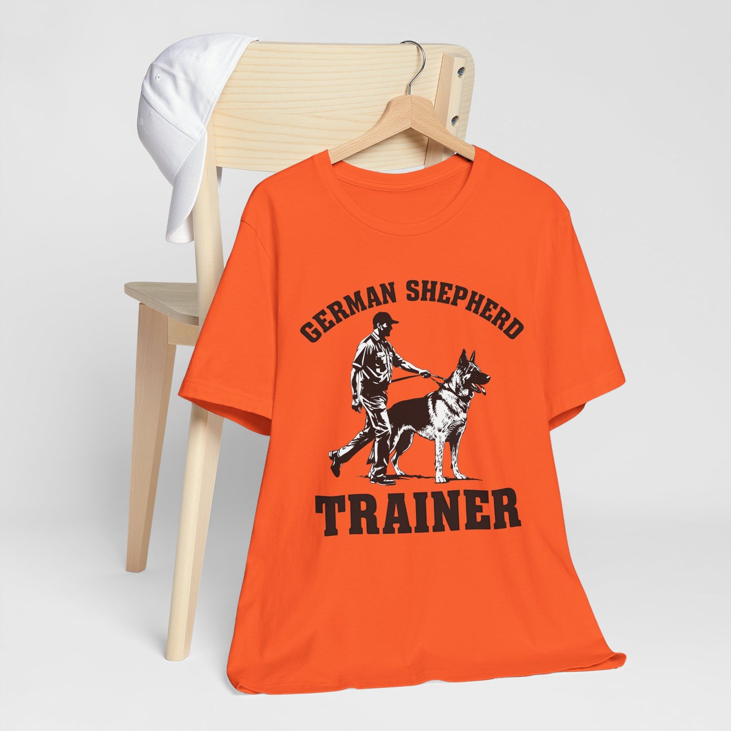 German Shepherd Trainer Tee - Black and White Design of Man Holding a German Shepherd