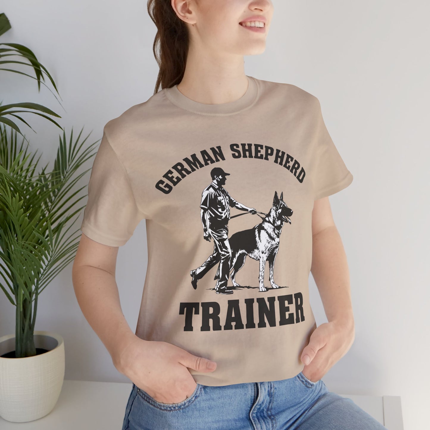 German Shepherd Trainer Tee - Black and White Design of Man Holding a German Shepherd