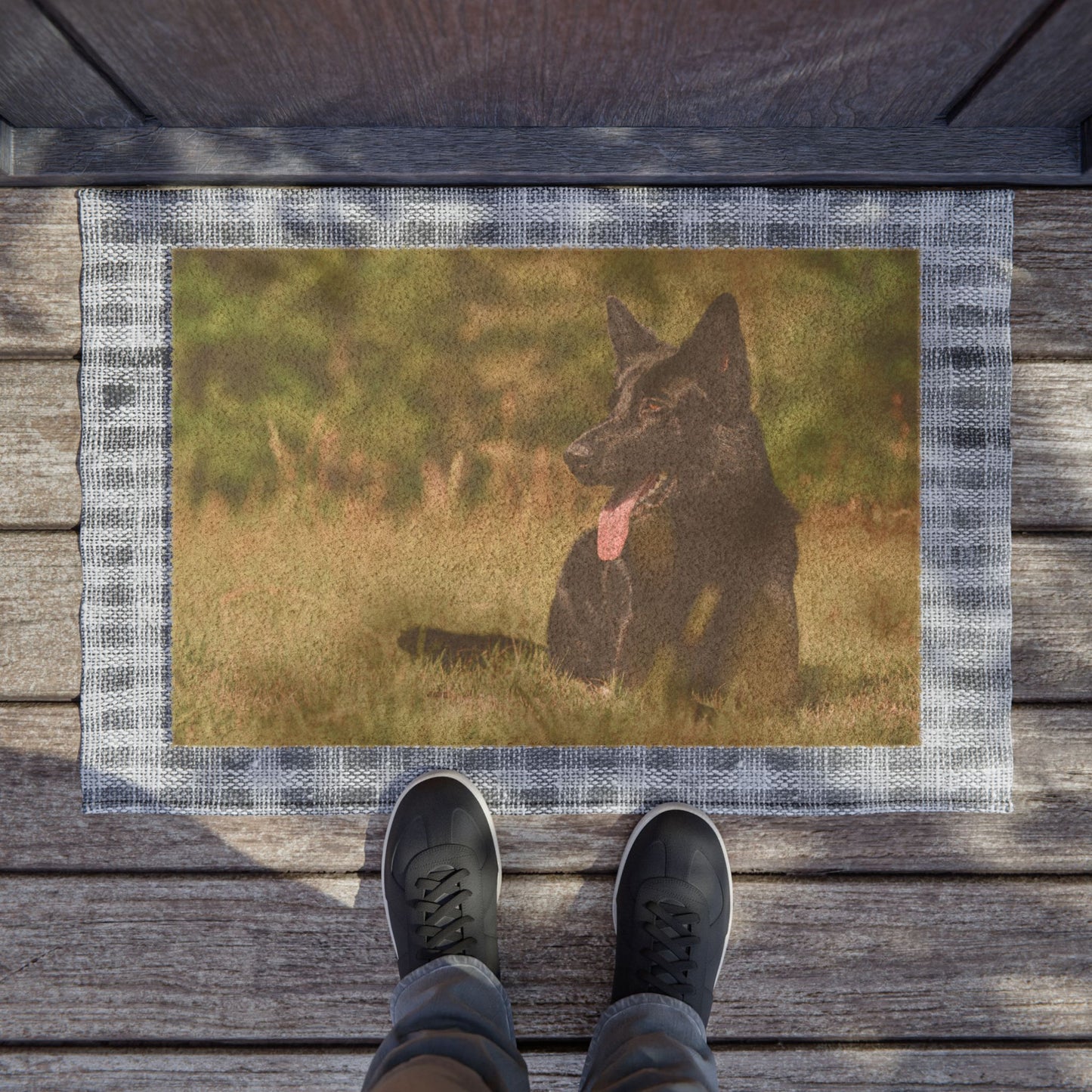 Dog Lovers Doormat Featuring a Solid Black German Shepherd Resting on the Grass With a Hanging Tongue
