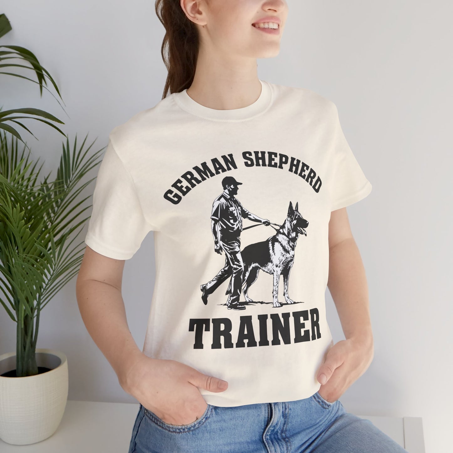 German Shepherd Trainer Tee - Black and White Design of Man Holding a German Shepherd