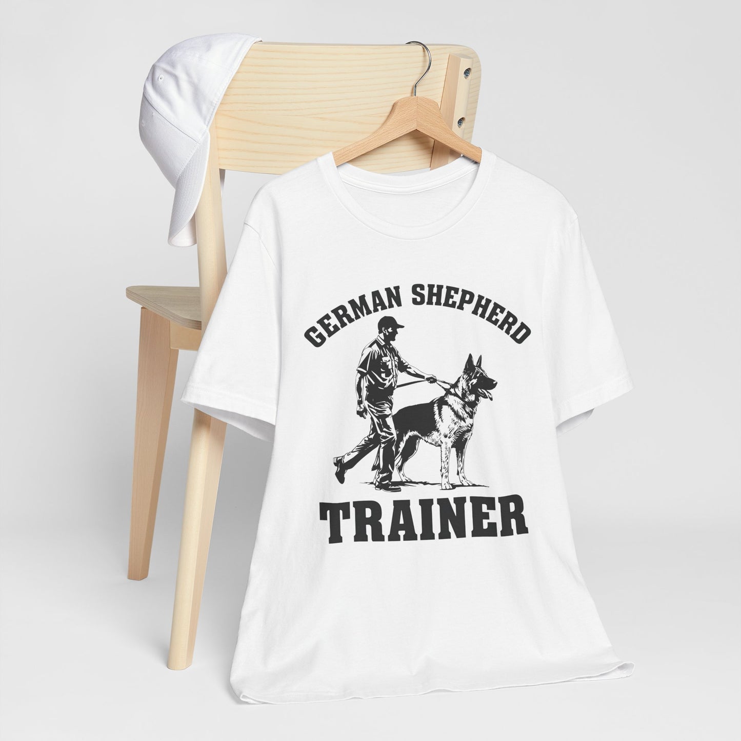 German Shepherd Trainer Tee - Black and White Design of Man Holding a German Shepherd