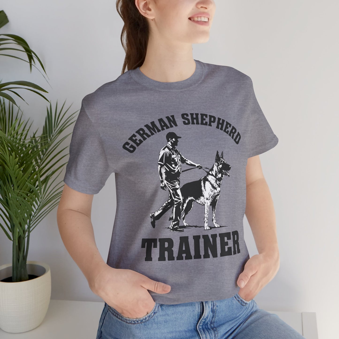 German Shepherd Trainer Tee - Black and White Design of Man Holding a German Shepherd