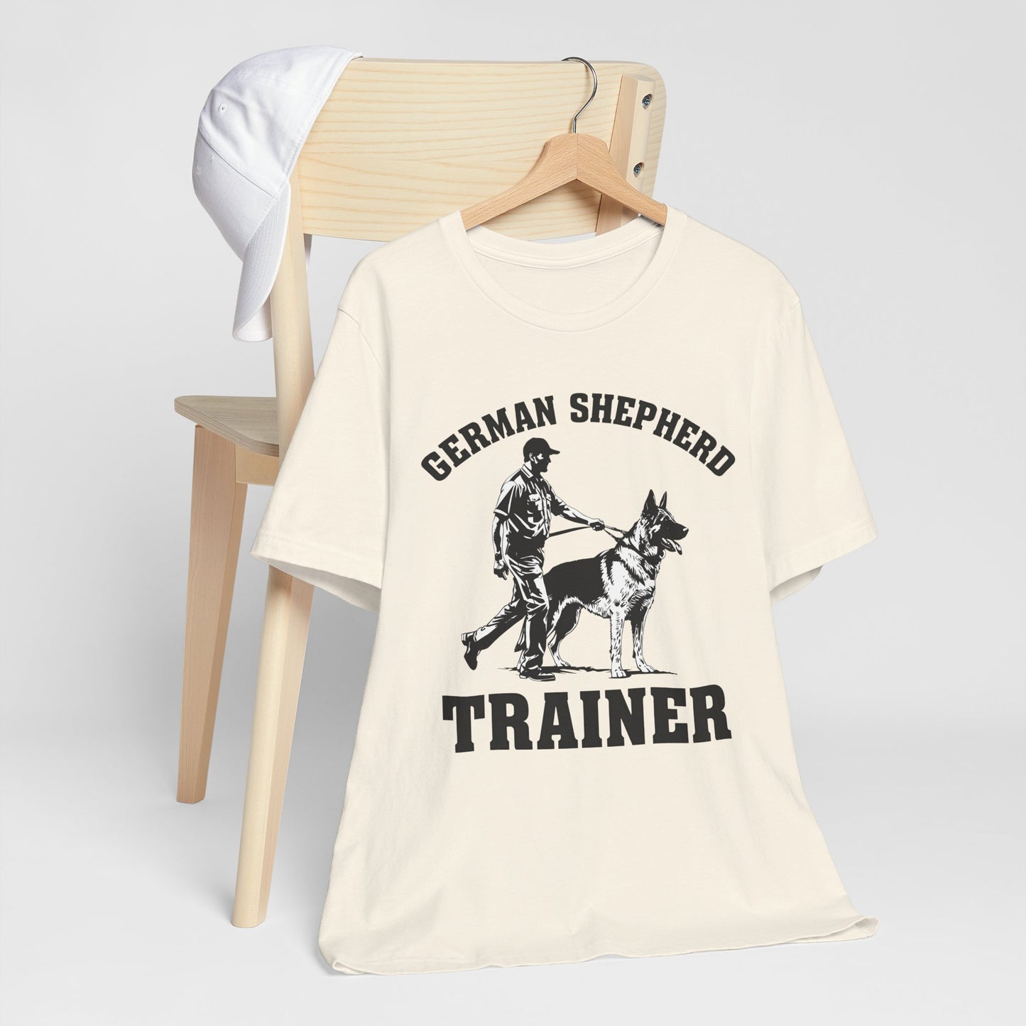 German Shepherd Trainer Tee - Black and White Design of Man Holding a German Shepherd